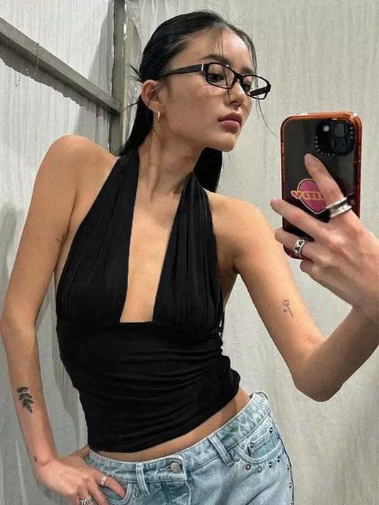 Shemoda: Sexy deep V-neck backless hanging neck tank top, elastic high waist slim fit short top | Nüra - Elevate your style with Shemoda's sexy black halter top. Deep V-neck, backless, and slim fit for a chic night out or casual elegance. - $17.00