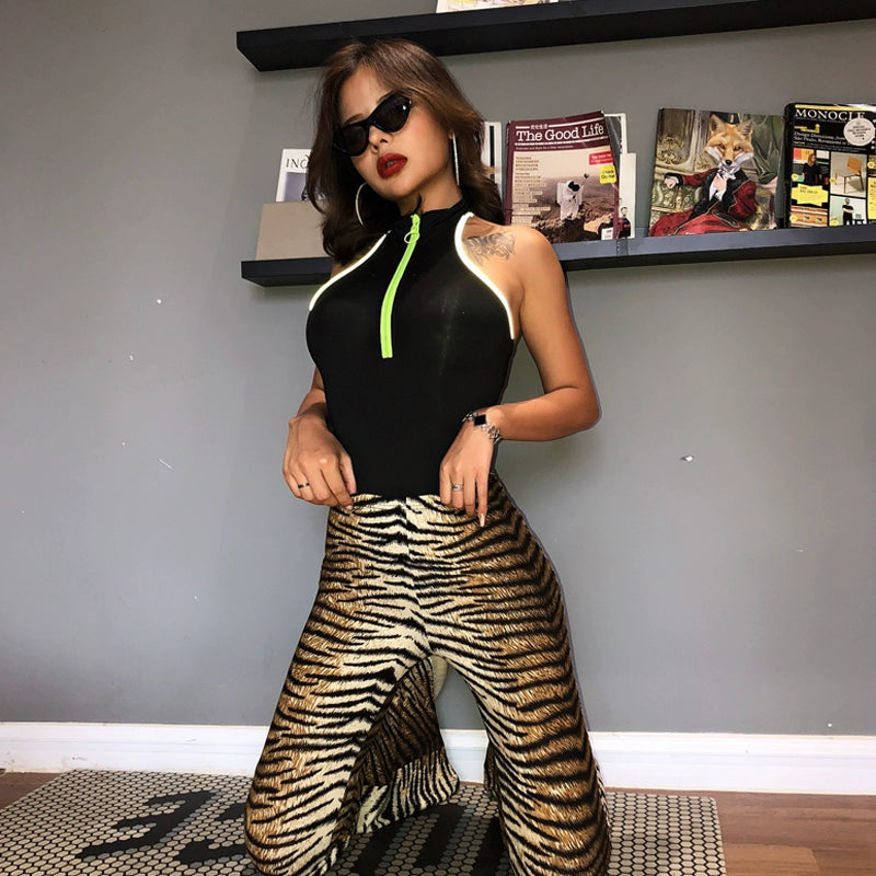 Shemoda: Iris Ember Pants | Nüra - Elevate your style in 2025 with Shemoda's Iris Ember Pants. High-waist, slimming flares in bold leopard & tiger prints for a retro, flattering fit. - $19.00