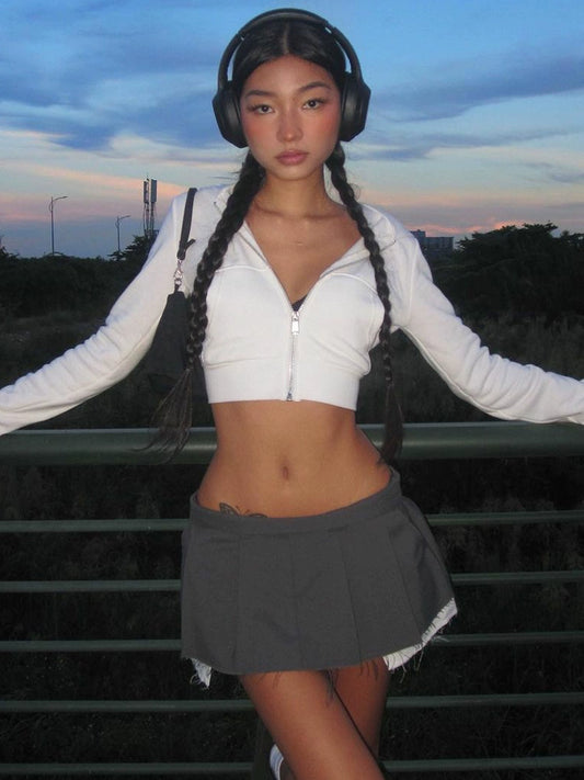 Shemoda: Aera Zip Hoodie | Nüra - Discover Shemoda's Aera Zip Hoodie: a stylish cropped, high-waisted hoodie with full zip and pockets. Perfect for layering in spring or autumn. - $19.00