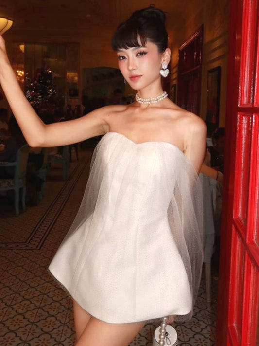 Shemoda: Fianna Ethereal Dress | Nüra - Discover elegance with Shemoda's Fianna Ethereal Dress: a strapless mini with a sweetheart neckline, shimmering fabric, and sheer tulle drapes. - $25.00