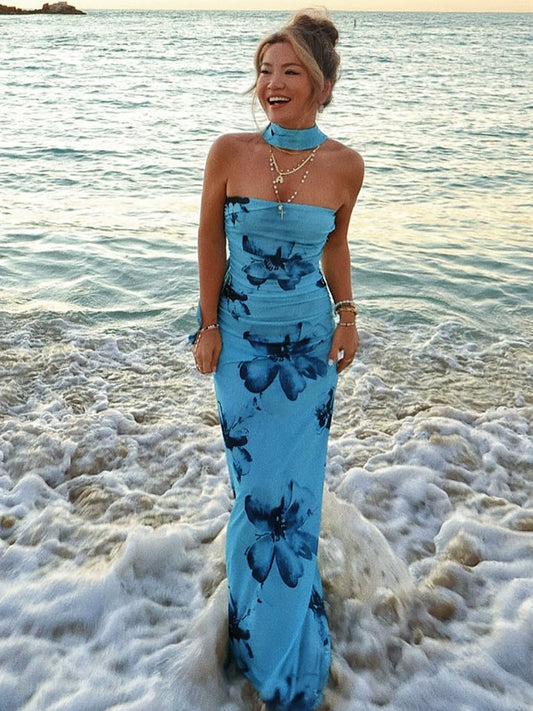 Shemoda: Sequoia Maxi Dress | Nüra - Elevate your style with Shemoda's Sequoia Maxi Dress. This floral halter-neck dress offers elegance and comfort for any summer event. - $28.00