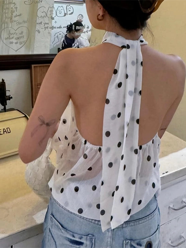 Shemoda: Zuri Halter Blouse | Nüra - Discover the Zuri Halter Blouse by Shemoda: a chic, backless chiffon top with playful polka dots and adjustable neck straps for versatile style. - $25.00