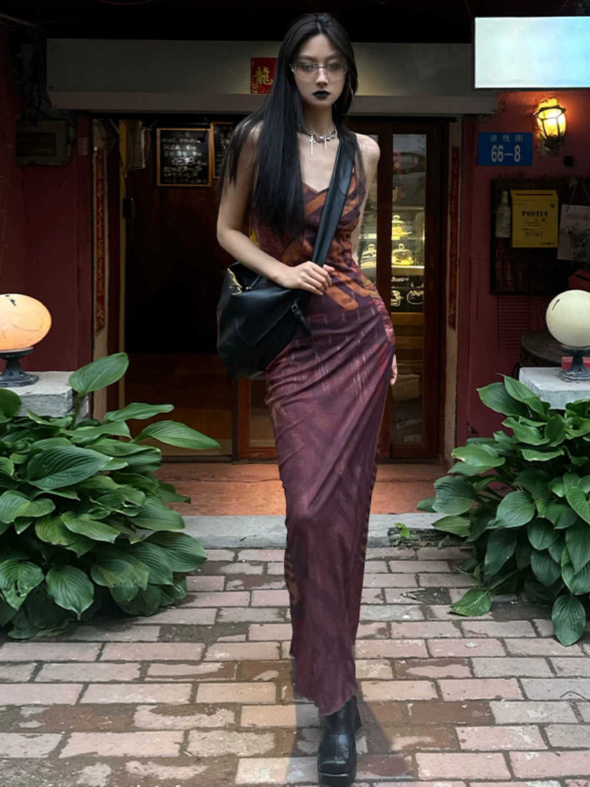 Shemoda: Zaya Slip Dress | Nüra - Discover the Zaya Slip Dress by Shemoda: a retro mesh design with a body-hugging fit, V-neck, backless cut, tribal print, and flared hem. - $22.00