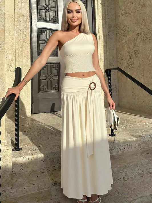 Shemoda: Empress Maxi Dress | Nüra - Elevate your style with Shemoda's Empress Maxi Dress. Featuring slanted shoulders and a slimming skirt for a confident, polished look. - $33.00