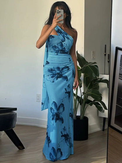 Shemoda: Sequoia Maxi Dress | Nüra - Elevate your style with Shemoda's Sequoia Maxi Dress. This floral halter-neck dress offers elegance and comfort for any summer event. - $28.00