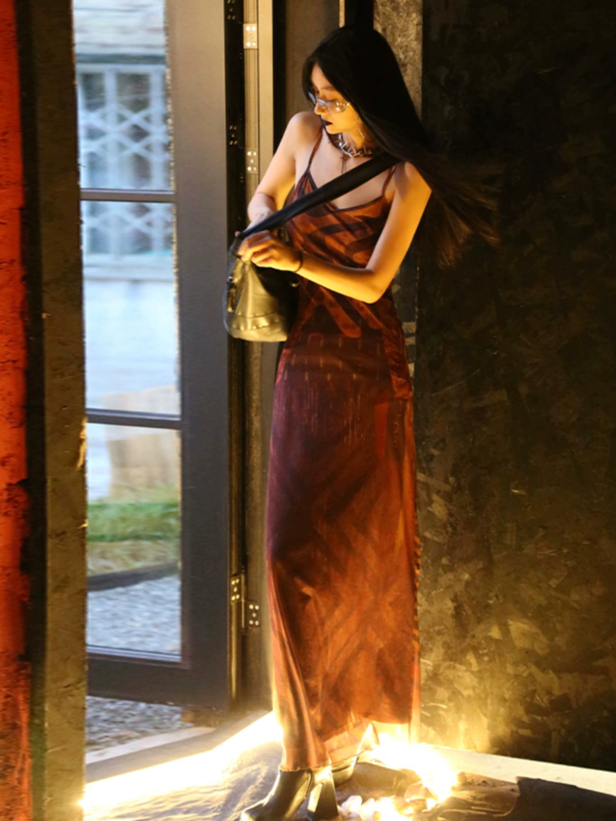 Shemoda: Zaya Slip Dress | Nüra - Discover the Zaya Slip Dress by Shemoda: a retro mesh design with a body-hugging fit, V-neck, backless cut, tribal print, and flared hem. - $22.00