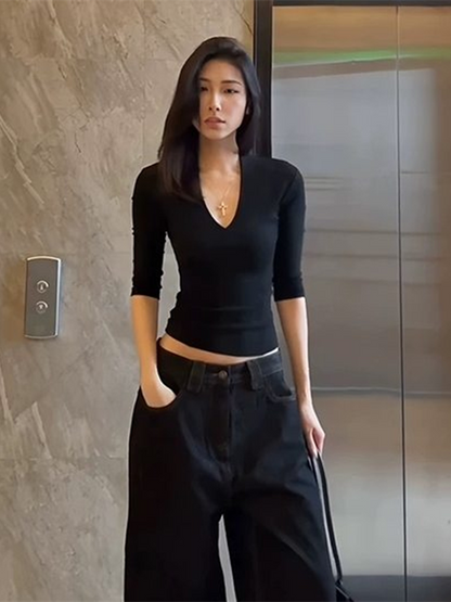 Shemoda: Ivy Luxe Crop | Nüra - Discover modern elegance with Shemoda's Ivy Luxe Crop. Featuring a sexy deep V-neck and fitted fabric, it's perfect for stylish casual or semi-formal looks. - $19.00
