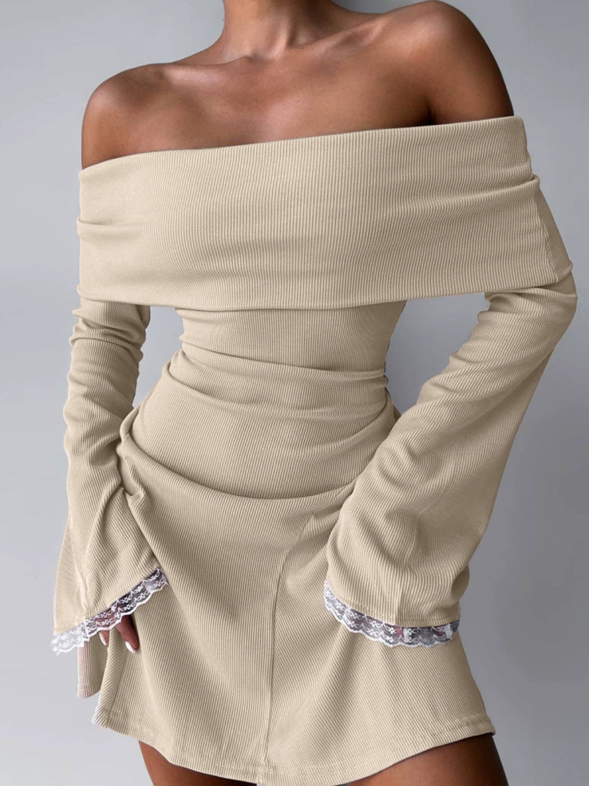 Shemoda: Lexi Off-shoulder Dress | Nüra - Discover the Lexi Off-shoulder Dress by Shemoda: a chic bodycon mini with ruffled neckline, bell sleeves, and lace trim for a modern, romantic look. - $22.00