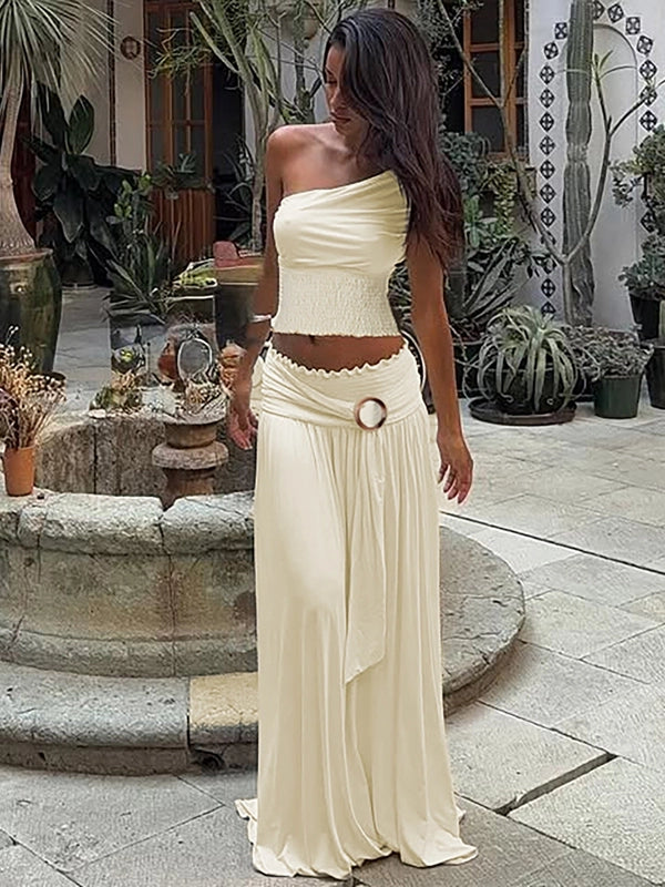 Shemoda: Empress Maxi Dress | Nüra - Elevate your style with Shemoda's Empress Maxi Dress. Featuring slanted shoulders and a slimming skirt for a confident, polished look. - $33.00