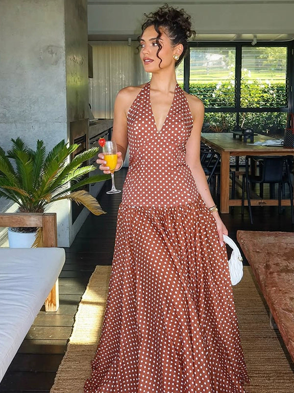 Shemoda: Ella Retro Dress | Nüra - Discover the Ella Retro Dress by Shemoda: a halter-neck polka dot maxi with a tie neck and flowy skirt, perfect for beach days and chic summer parties. - $24.00