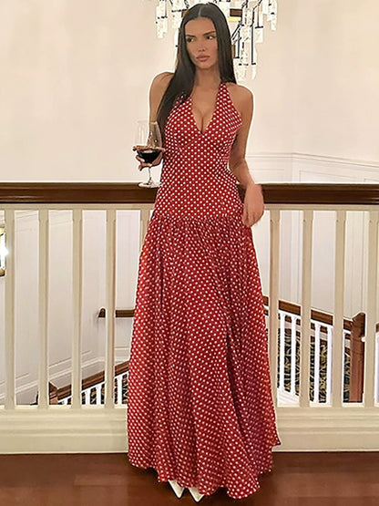 Shemoda: Ella Retro Dress | Nüra - Discover the Ella Retro Dress by Shemoda: a halter-neck polka dot maxi with a tie neck and flowy skirt, perfect for beach days and chic summer parties. - $24.00