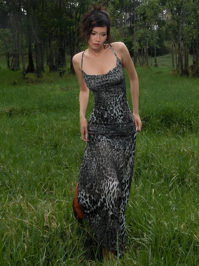 Shemoda: Willow Wildprint Dress | Nüra - Discover Shemoda's Willow Wildprint Dress: a bold leopard print with a backless cut, draped neckline, and flowing mesh skirt for effortless elegance. - $21.00