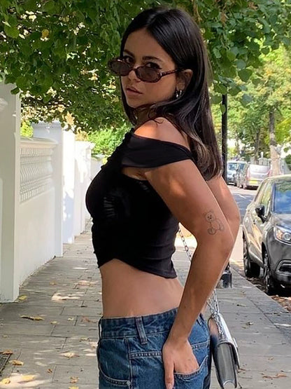 Shemoda: Sera Slant Tee | Nüra - Discover the chic Sera Slant Tee by Shemoda: a single-shoulder, asymmetrical design with ruching for a slim fit. Perfect for modern, everyday style. - $17.00