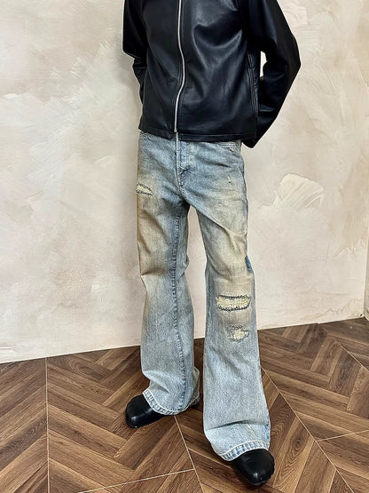 MUKHINA: Distressed Micro Brushed Flared Jeans | Nüra - Discover MUKHINA's Distressed Micro Brushed Flared Jeans for men, blending modern style with comfort. Perfect fit with a subtle distressed look. - $100.00