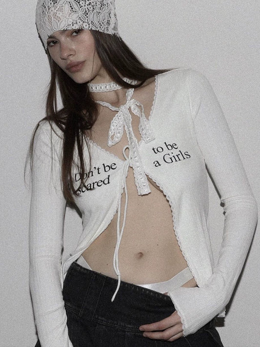 Shemoda: Romi Femme Cardigan | Nüra - Discover the Romi Femme Cardigan by Shemoda: a long, slim-fit lace top with a daring V-neck and stylish drawstring for a subtly sexy look. - $24.00