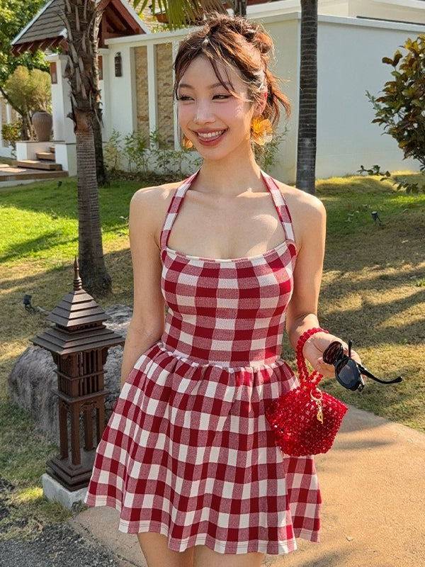 Shemoda: Freya Retro Halter Dress | Nüra - Discover Shemoda's Freya Retro Halter Dress: a chic Hong Kong-style plaid dress with a backless cut and pleated skirt, perfect for summer outings. - $19.00