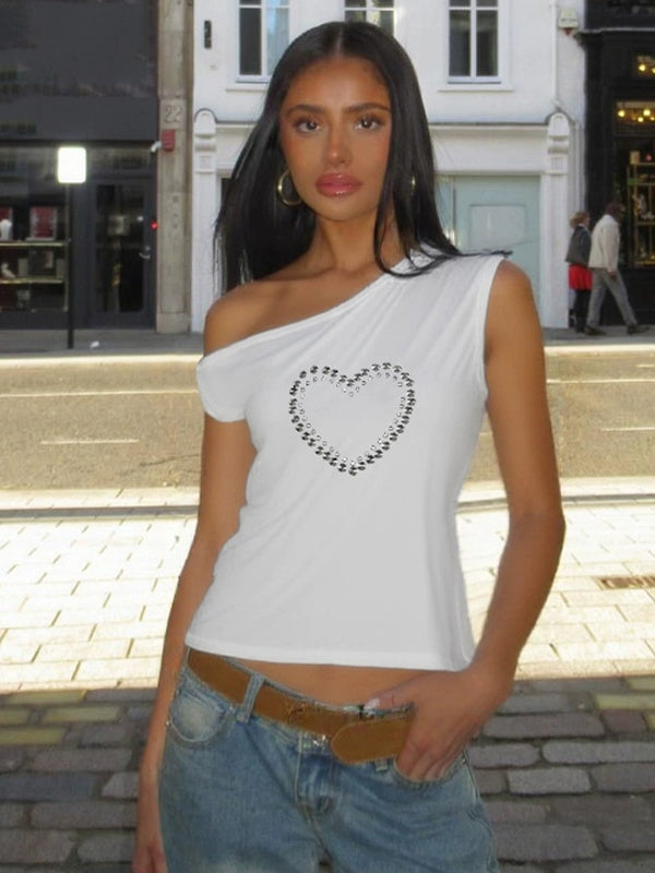 Shemoda: Blaze Studded Top | Nüra - Discover Shemoda's Blaze Studded Crop Top: a bold, spicy design with metal heart print, slanted collar, and off-shoulder cut for a chic, modern style. - $19.00