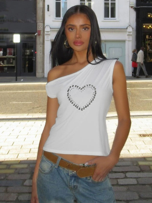 Shemoda: Blaze Studded Top | Nüra - Discover Shemoda's Blaze Studded Crop Top: a bold, spicy design with metal heart print, slanted collar, and off-shoulder cut for a chic, modern style. - $19.00