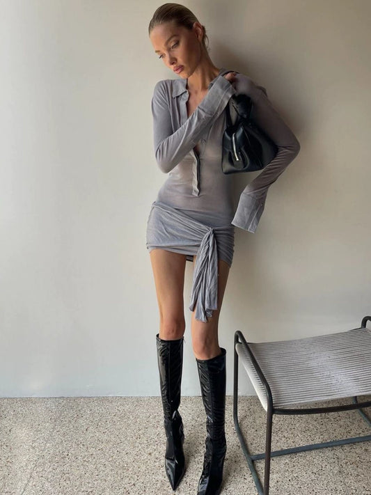 Shemoda: Lexi Shirt Dress | Nüra - Discover elegance with Shemoda's Lexi Shirt Dress. Featuring a slimming fit, classic collar, and asymmetrical ruched hem for a chic look. - $30.00
