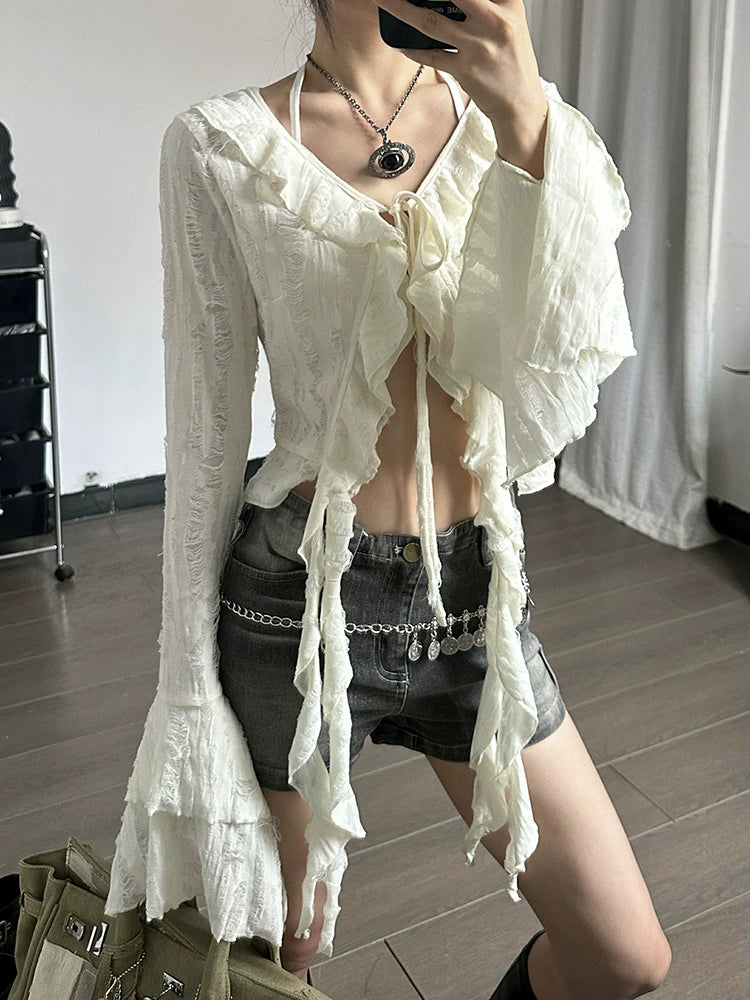 Shemoda: Fern Boho Top | Nüra - Discover Shemoda's Fern Boho Top: a long-sleeve, semi-transparent beauty with ruffles. Slim fit for a flattering silhouette. Perfect for any occasion! - $24.00