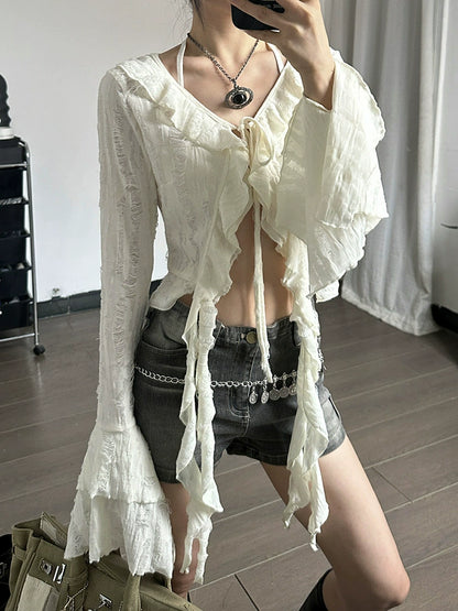 Shemoda: Fern Boho Top | Nüra - Discover Shemoda's Fern Boho Top: a long-sleeve, semi-transparent beauty with ruffles. Slim fit for a flattering silhouette. Perfect for any occasion! - $24.00