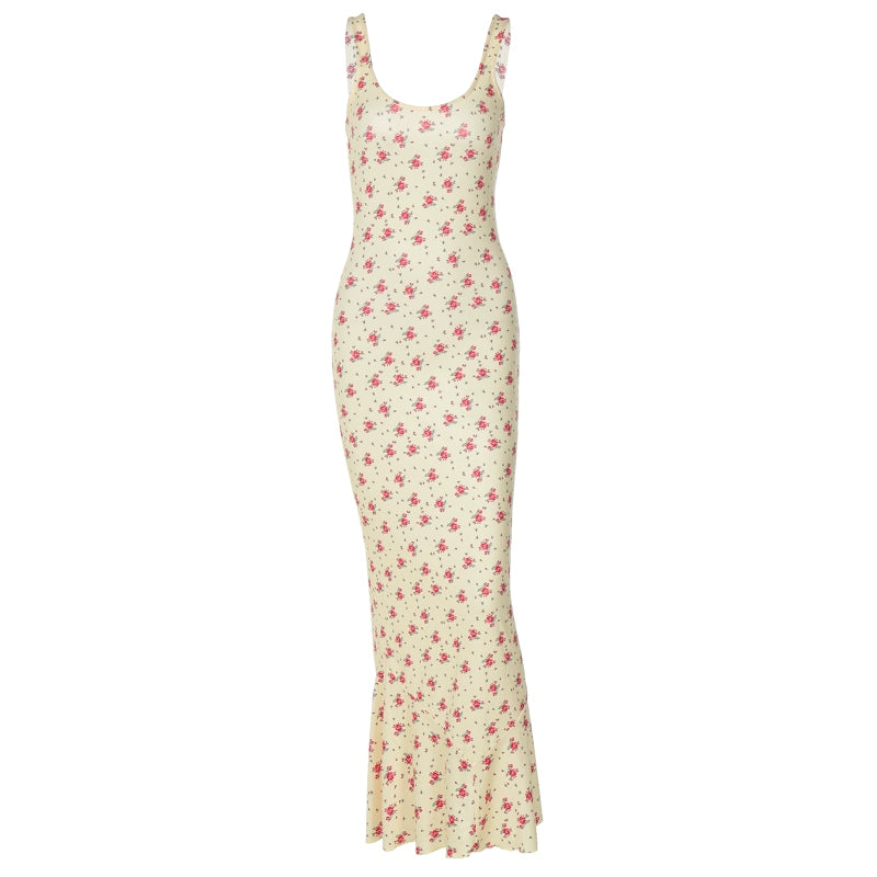 Shemoda: Raya Sundress | Nüra - Discover Shemoda's Raya Sundress: a sleeveless yellow floral dress with a scoop neck and fishtail hem, perfect for elegant warm-weather events. - $20.00