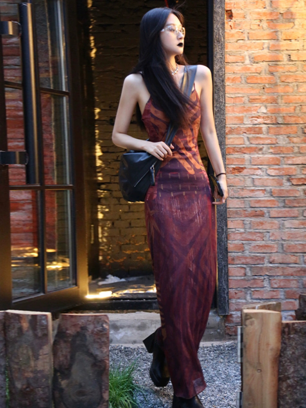 Shemoda: Zaya Slip Dress | Nüra - Discover the Zaya Slip Dress by Shemoda: a retro mesh design with a body-hugging fit, V-neck, backless cut, tribal print, and flared hem. - $22.00