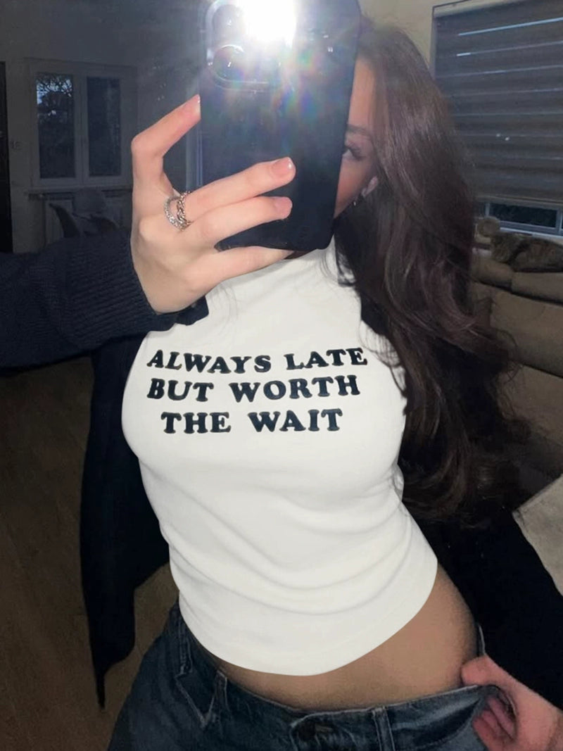 Shemoda: Lira Printed Tee | Nüra - Discover Shemoda's Lira Printed Tee: a chic, fitted crop with cheeky text. Perfectly pairs with high-waisted styles for a confident look. - $17.00