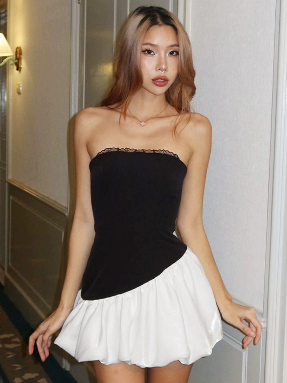 Shemoda: Daisy Bounce Dress | Nüra - Discover Shemoda's Daisy Bounce Dress: a strapless mini with a fitted bodice, asymmetrical bubble hem, and playful volume for a bold, feminine style. - $22.00