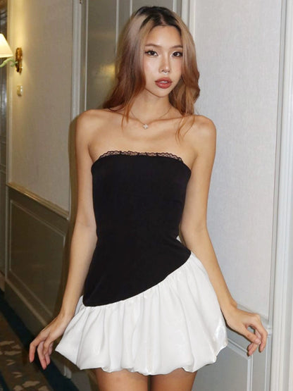 Shemoda: Daisy Bounce Dress | Nüra - Discover Shemoda's Daisy Bounce Dress: a strapless mini with a fitted bodice, asymmetrical bubble hem, and playful volume for a bold, feminine style. - $22.00