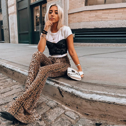 Shemoda: Iris Ember Pants | Nüra - Elevate your style in 2025 with Shemoda's Iris Ember Pants. High-waist, slimming flares in bold leopard & tiger prints for a retro, flattering fit. - $19.00