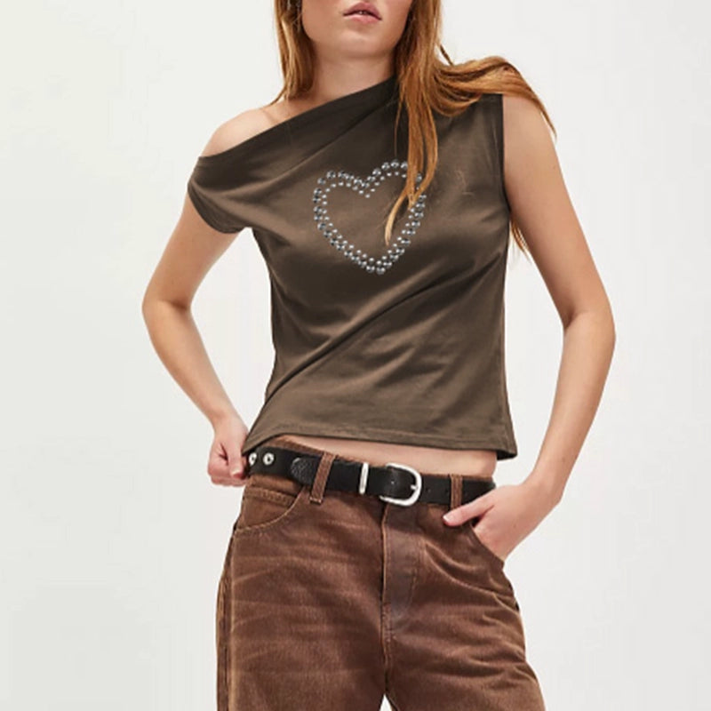 Shemoda: Blaze Studded Top | Nüra - Discover Shemoda's Blaze Studded Crop Top: a bold, spicy design with metal heart print, slanted collar, and off-shoulder cut for a chic, modern style. - $19.00