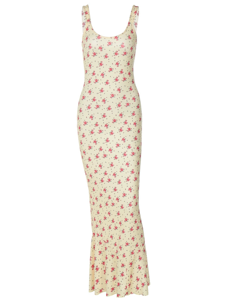 Shemoda: Raya Sundress | Nüra - Discover Shemoda's Raya Sundress: a sleeveless yellow floral dress with a scoop neck and fishtail hem, perfect for elegant warm-weather events. - $20.00
