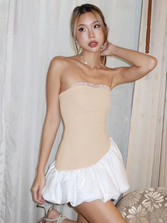 Shemoda: Daisy Bounce Dress | Nüra - Discover Shemoda's Daisy Bounce Dress: a strapless mini with a fitted bodice, asymmetrical bubble hem, and playful volume for a bold, feminine style. - $22.00
