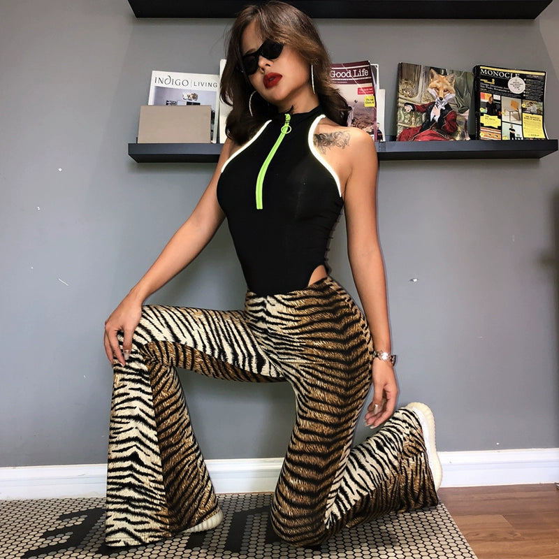 Shemoda: Iris Ember Pants | Nüra - Elevate your style in 2025 with Shemoda's Iris Ember Pants. High-waist, slimming flares in bold leopard & tiger prints for a retro, flattering fit. - $19.00