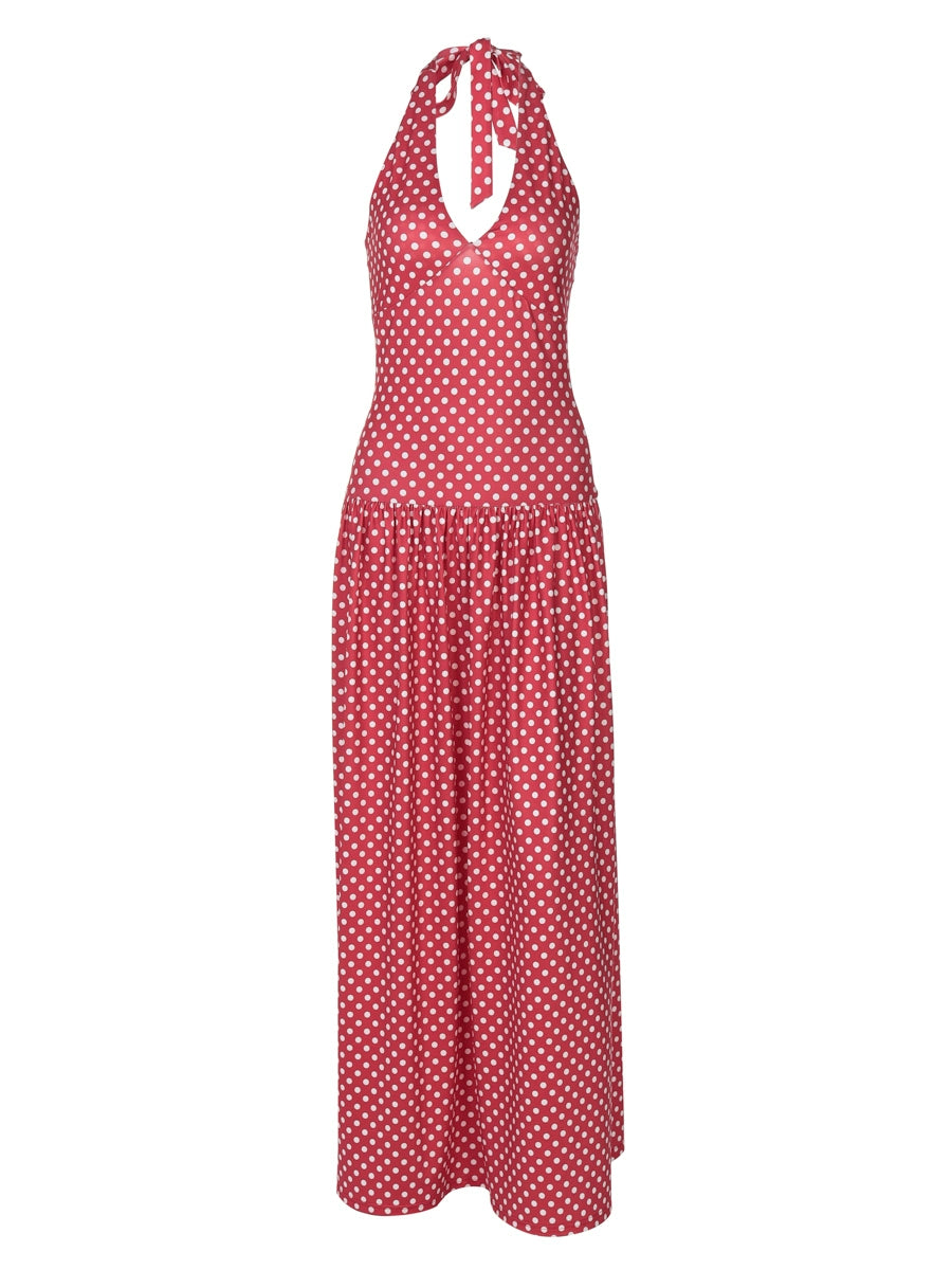 Shemoda: Ella Retro Dress | Nüra - Discover the Ella Retro Dress by Shemoda: a halter-neck polka dot maxi with a tie neck and flowy skirt, perfect for beach days and chic summer parties. - $24.00
