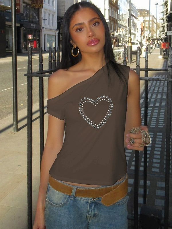 Shemoda: Blaze Studded Top | Nüra - Discover Shemoda's Blaze Studded Crop Top: a bold, spicy design with metal heart print, slanted collar, and off-shoulder cut for a chic, modern style. - $19.00