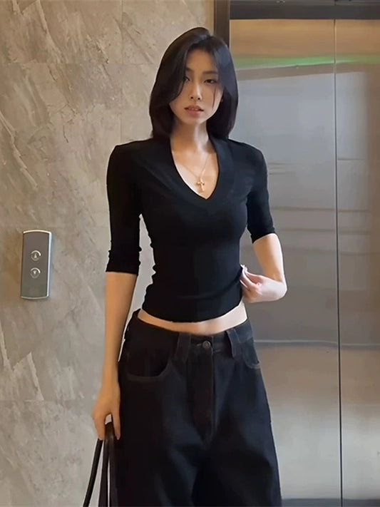 Shemoda: Ivy Luxe Crop | Nüra - Discover modern elegance with Shemoda's Ivy Luxe Crop. Featuring a sexy deep V-neck and fitted fabric, it's perfect for stylish casual or semi-formal looks. - $19.00