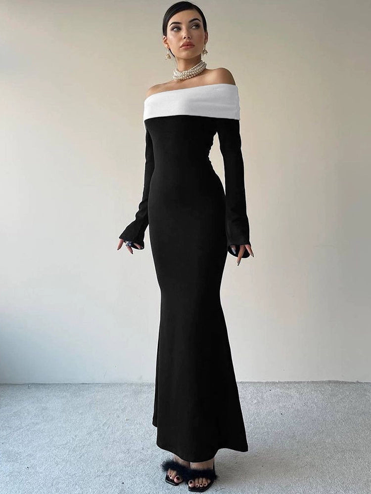 Shemoda: Pia Classic Dress | Nüra - Elevate your style with Shemoda's Pia Classic Dress. Elegant black gown, white off-shoulder neckline, long sleeves, and a flattering silhouette. - $20.00